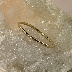 Solid 14kt yellow gold skinny twisted band. Stacking and wedding band.