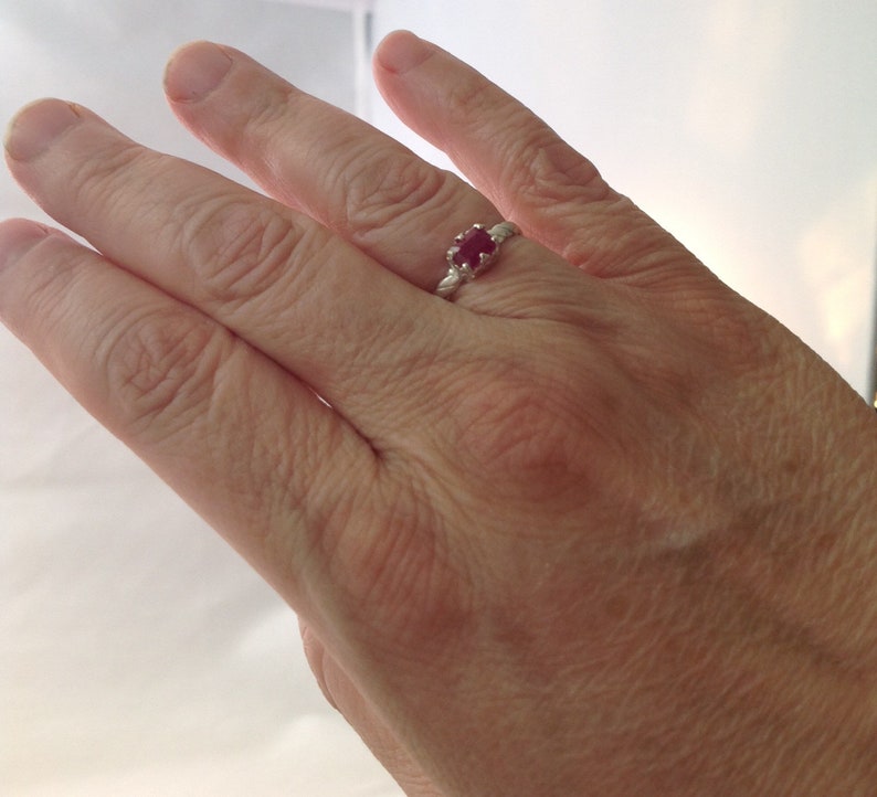 handmade ring with a fancy bezel and twisted domed band Genuine emerald cut ruby set in solid silver Ruby is Julys birthstone.