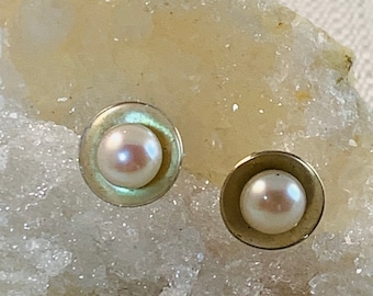 Pearl stud earrings in sterling silver. Pearls are the birthstone for June. White freshwater pearls.