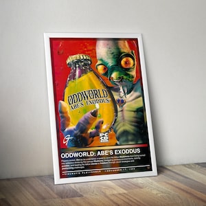 May include: A framed poster for the video game "Oddworld: Abe's Exoddus." The artwork features a green alien holding a bottle of yellow liquid with the game's title. The poster has a red and black background with text at the bottom.