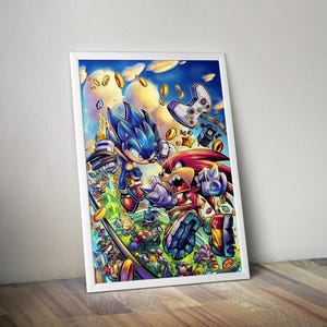 May include: A framed print featuring a dynamic illustration of Sonic the Hedgehog and Knuckles the Echidna in action. The artwork showcases vibrant colors, floating gold coins, and a video game controller against a blue sky background. The print is set in a white frame.