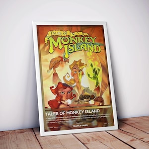 May include: A framed poster for the video game "Tales of Monkey Island." The artwork features a stylized illustration with characters and the game's title in a vibrant design. The poster is leaning against a wall on a wooden surface.