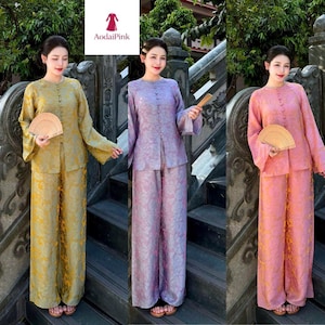 May include: A set of three ceramic mugs with a speckled, matte finish. The mugs are in shades of cream, light gray, and dark gray. Each mug has a simple, minimalist design, perfect for coffee or tea.