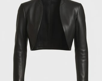 May include: A black leather bolero jacket with long sleeves. The jacket features a round neckline and an open front. The leather has a smooth appearance with a subtle sheen. The jacket is cropped, finishing at the waist.
