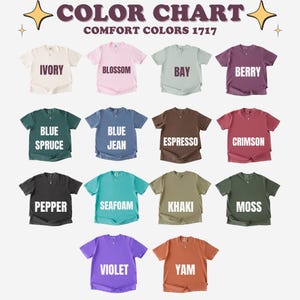 May include: A color chart displays a variety of Comfort Colors 1717 t-shirts in various shades. Colors include Ivory, Blossom, Bay, Berry, Blue Spruce, Blue Jean, Espresso, Crimson, Pepper, Seafoam, Khaki, Moss, Violet, and Yam.