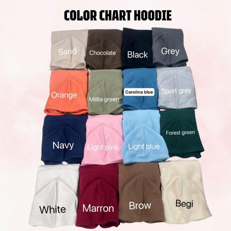 May include: A color chart for hoodies featuring folded fabric samples in various shades including sand, chocolate, black, grey, orange, military green, Carolina blue, sport grey, navy, light pink, light blue, forest green, white, maroon, brown, and beige.