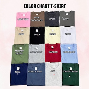 May include: A color chart t-shirt display featuring sixteen folded shirts in various colors including light pink, dark chocolate, wash, grey, sand, black, beige, white, military green, sport grey, maroon, light blue, navy, corola blue, ash, and forest green.