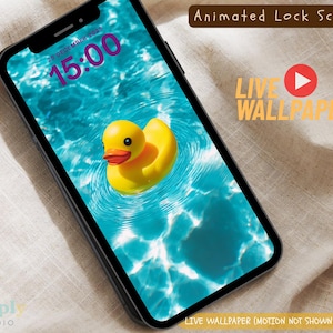 May include: A smartphone displays a live wallpaper of a yellow rubber duck floating in blue water. The screen shows the date and time, with the words "Animated Lock Screen" and "Live Wallpaper".