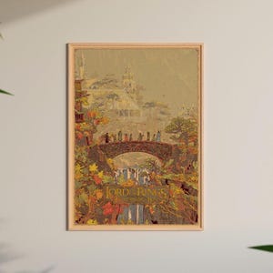 May include: A framed poster with a vintage illustration of a bridge with figures, set in a fantasy landscape. The poster has a warm colour palette and the text "LORD OF THE RINGS" at the bottom. The artwork evokes a sense of adventure.