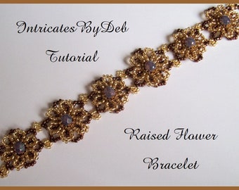 May include: A gold and brown beaded bracelet with raised flower accents. The bracelet is made with small seed beads and features a dark brown center bead in each flower. The text "Intricates By Deb Tutorial" and "Raised Flower Bracelet" is visible in the image.
