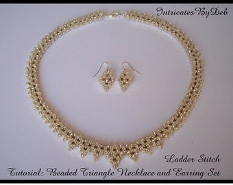 May include: A silver beaded triangle necklace and matching earrings set. The necklace is made with a ladder stitch and features a delicate, geometric design. The earrings are small and dangle from silver hooks.