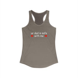 May include: A gray racerback tank top with the text "ur dad is safe with me" in white, with two red heart symbols. The tank top has a scoop neck and a racerback design.