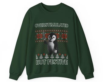 Sudadera navideña con pingüino sobreestimulado pero festivo
