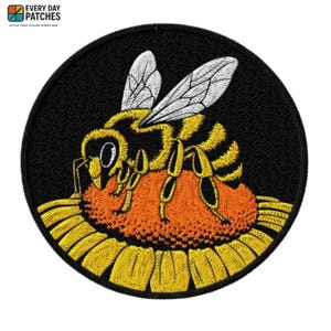 May include: Embroidered patch featuring a yellow and black bee on an orange flower, set against a black circular background. The patch has a detailed design with the text "EVERY DAY PATCHES" at the top.