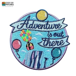 May include: Embroidered patch with the words "Adventure is out there" in navy blue script on a light blue background. The patch features a colorful hot air balloon, balloons, and a yellow circle.