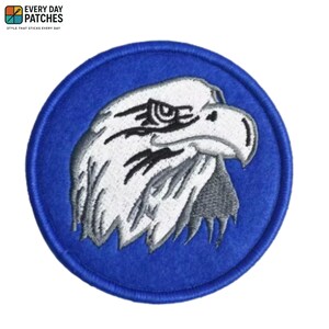 May include: Embroidered patch with a detailed eagle head in white and grey, set against a vibrant blue circular background. The patch includes the text "EVERY DAY PATCHES" and "STYLE THAT STICKS EVERY DAY".