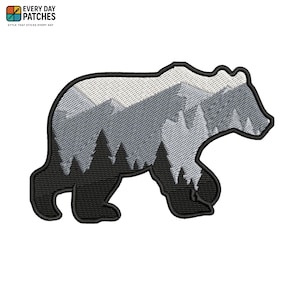 May include: Embroidered patch in the shape of a bear, featuring a mountain and forest landscape in shades of gray and black. The patch has a black border and the text "EVERY DAY PATCHES" at the top.