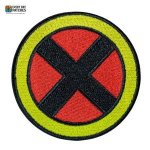 May include: Embroidered patch featuring a red circle with a black 'X' and a yellow border. The patch has the text "EVERY DAY PATCHES" and "STYLE THAT STICKS EVERY DAY" in the upper left corner.
