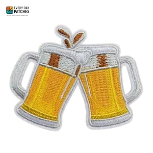 May include: Embroidered patch featuring two beer mugs clinking together. The mugs are filled with golden beer and topped with white foam. The patch has a white border and the text "EVERY DAY PATCHES" at the top.