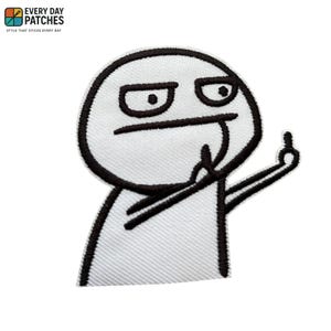 May include: White patch with a black outline of a meme character giving the middle finger. The patch has the text "EVERY DAY PATCHES" and "STYLE THAT STICKS EVERY DAY" in the upper left corner.