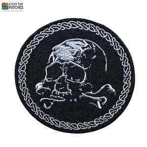 May include: Round black patch with a skull and crossbones design. The skull and bones are white, with a white border. The patch has the text "EVERY DAY PATCHES" at the top.