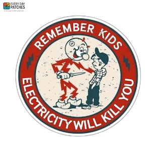 May include: Round patch with a red border and the text "REMEMBER KIDS ELECTRICITY WILL KILL YOU". The patch features a cartoon character made of lightning holding a knife, confronting a boy in a cap.
