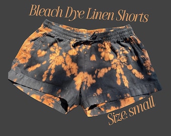 Pantalones cortos medianos negros teñidos con lejía