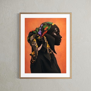 Könnte beinhalten: Gerahmter Kunstdruck mit dem Profil einer Person, die ein schwarzes Oberteil und ein floral gemustertes Kopftuch trägt. Das Kopftuch hat einen schwarzen Hintergrund mit bunten Blumen und gelben Akzenten. Der Hintergrund ist orange.
