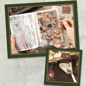 May include: A scrapbook page with coffee-themed stickers, including coffee cups, pastries, and a miniature coffee maker. The page is open, revealing various stickers and a hand holding a sticker. The image is framed in green.