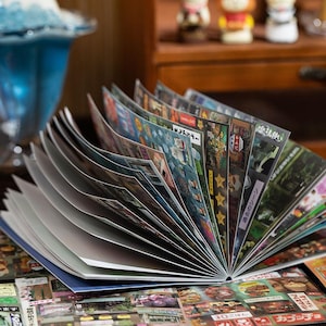 Flip-through view of the 900-piece Japanese retro sticker book with assorted aesthetic stickers for scrapbooking and crafting.