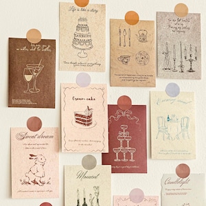 Pode incluir: Uma coleção de cartões de papel decorativos com várias ilustrações e texto. Os cartões são em tons de castanho, vermelho e creme, com desenhos de um bolo, taças de vinho e velas. O texto inclui frases como "A vida é como uma história" e "Doce sonho".