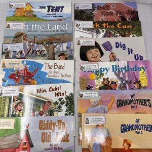 May include: A collection of ten children's storybooks with illustrated covers featuring titles such as The Tent, Bell Can Fix It, To the Land, Kick the Can, A Tree, Dig It Up, The Band, Happy Birthday, Win, Cubs! Win!, At Grandmother's Part 1 and 2, and Giddy-Up, Old Jack.