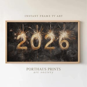 Pode incluir: Impressão de arte digital emoldurada com o ano de 2026 em dourado, estilizado como fogos de artifício contra um fundo escuro e texturizado. Inclui o texto "INSTANT FRAME TV ART" e "PORTHAUS PRINTS art society".