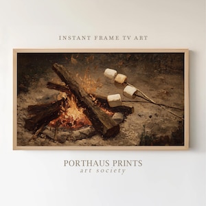 May include: A framed digital art print depicts a campfire scene with burning logs and flames. Marshmallows are roasting on sticks. The text "INSTANT FRAME TV ART" and "PORTHAUS PRINTS art society" are visible.