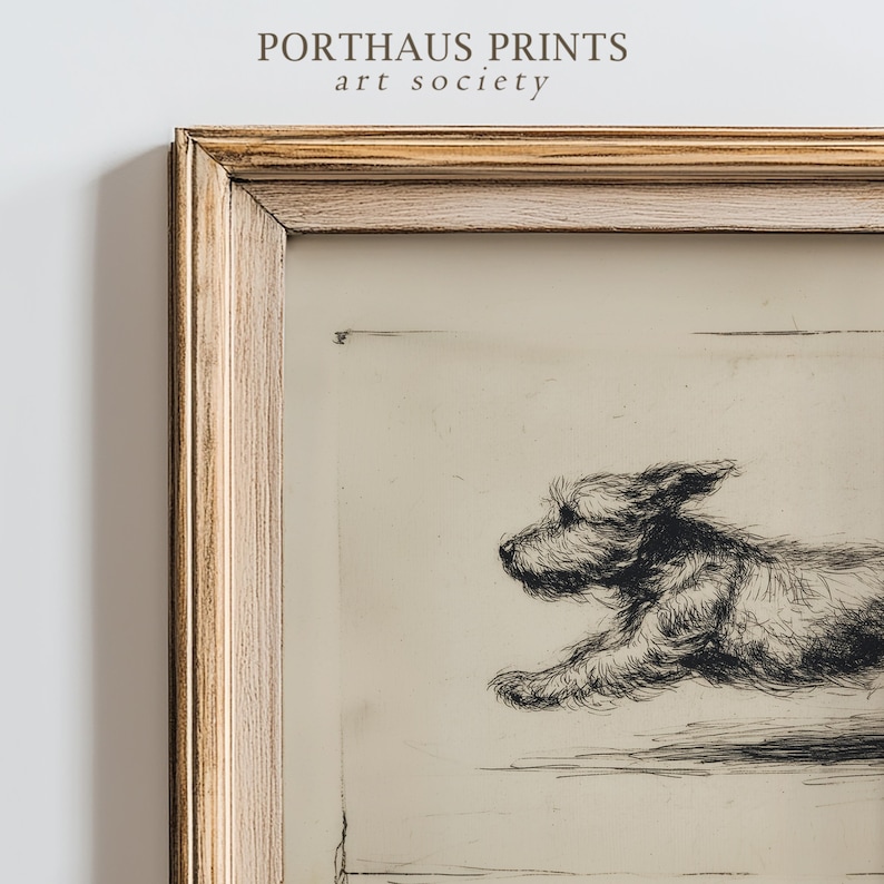 May include: Framed black and white etching of a running dog. The artwork is in a gold-toned wooden frame. The text "PORTHAUS PRINTS art society" is printed at the top of the image.