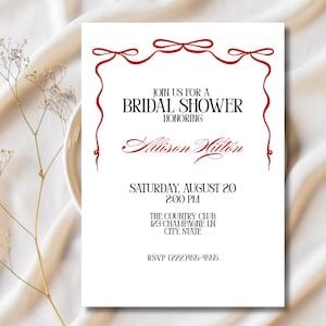 May include: White invitation card with red decorative border and text. The card reads "Join us for a Bridal Shower Honoring Allison Hilton" and includes the date, time, and RSVP information.