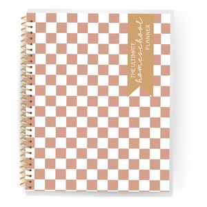 May include: A spiral-bound planner with a checkered pattern in white and a muted reddish-brown color. The cover features a gold spiral binding and a tan banner with the text "THE ULTIMATE homeschool PLANNER".