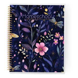 May include: Homeschool undated planner with a floral design. The cover features a dark blue background with watercolor illustrations of pink flowers, purple leaves, and butterflies. The spiral binding is gold.