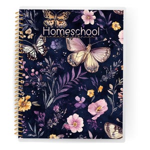 May include: A spiral-bound homeschool planner with a white border. The cover features a dark blue background with watercolor butterflies, flowers, and foliage in shades of pink, yellow, and purple. The word "Homeschool" is printed on the cover.