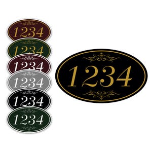 May include: Oval-shaped house number signs in various colors, including black, green, and burgundy. Each sign displays the number "1234" in a contrasting color, with decorative flourishes. The signs are designed for outdoor use.