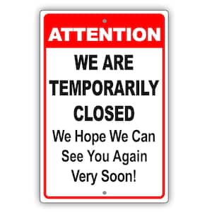 May include: A rectangular sign with a red border and a red top section that reads "ATTENTION." The sign states "WE ARE TEMPORARILY CLOSED" and "We Hope We Can See You Again Very Soon!" in black text on a white background.