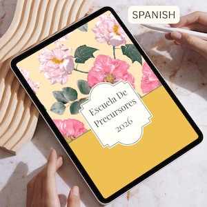 May include: A digital tablet displays a floral design with pink flowers and green leaves on a light yellow background. The text "Escuela De Precursores 2026" is in a white decorative frame. The tablet is held by two hands.