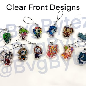 May include: Clear front designs of various cartoon character charms. Each charm is a different character with unique colors and designs, attached to a black lanyard. The charms are made of clear acrylic.