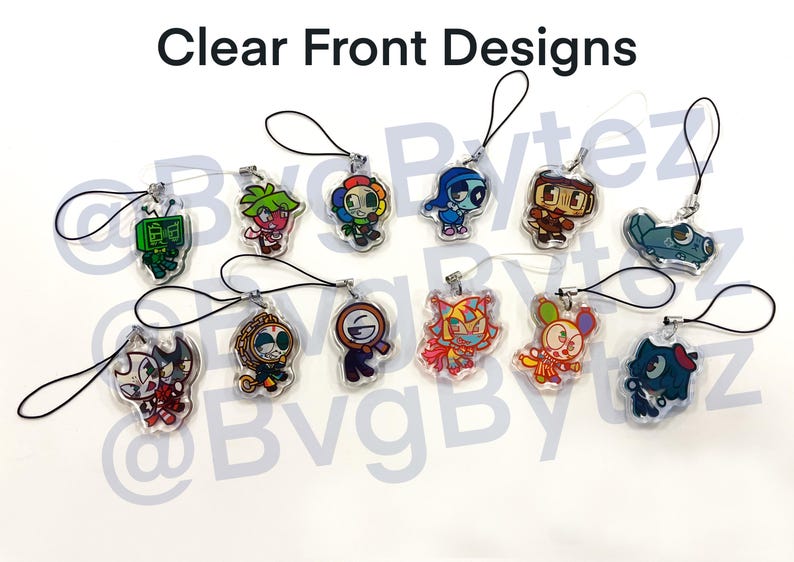 May include: Clear front designs of various cartoon character charms. Each charm is a different character with unique colors and designs, attached to a black lanyard. The charms are made of clear acrylic.