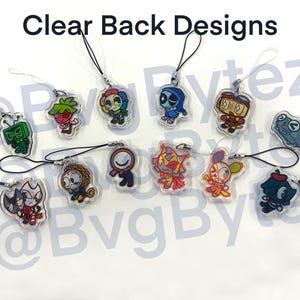 May include: Clear acrylic charms with various cartoon character designs. Each charm features a unique character with vibrant colors and attached with a black string. The charms are suitable for use as keychains or decorative accessories.