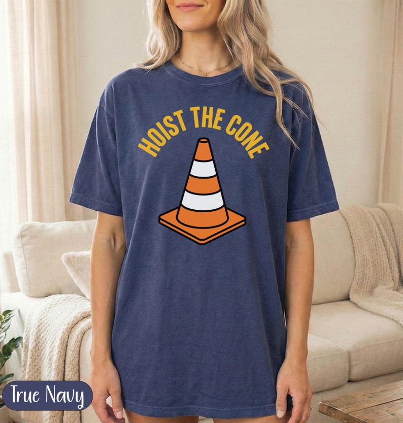 Navy t-shirt with orange traffic cone graphic and "Hoist the cone" text.