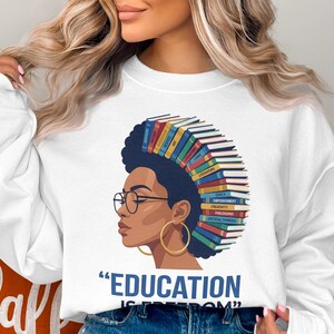 Woman with books as hair, "Education is Freedom" text.