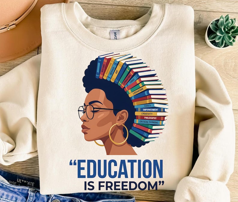 Woman with books in her hair, wearing glasses, text "EDUCATION IS FREEDOM".
