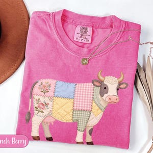 May include: A rustic wooden sign with the text "Welcome to our home" in white lettering. The sign features a distressed finish and a simple, inviting design, perfect for entryway decor.