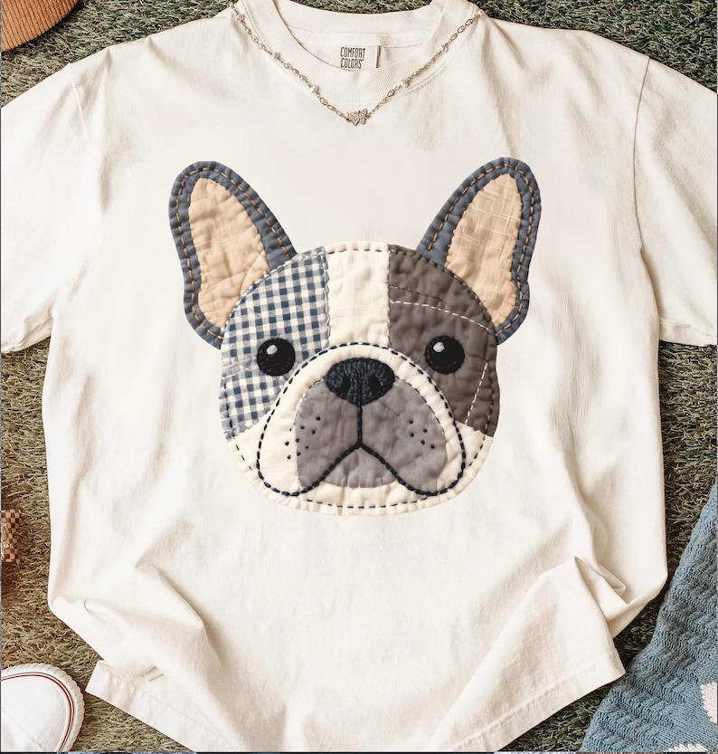 White t-shirt with a stitched French bulldog applique.